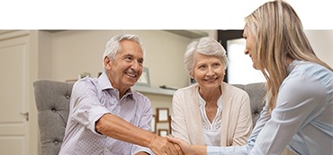 A senior couple meeting a healthcare navigator