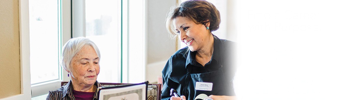 Senior resident placing an order with a smiling waitress